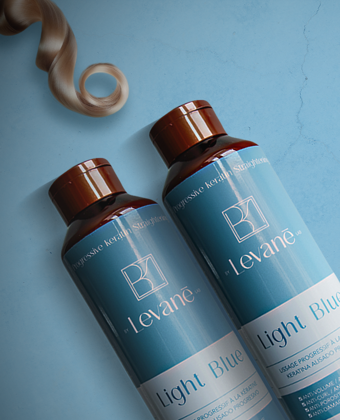 Two bottles of Leváne hair product on a blue background with a strand of blonde hair.