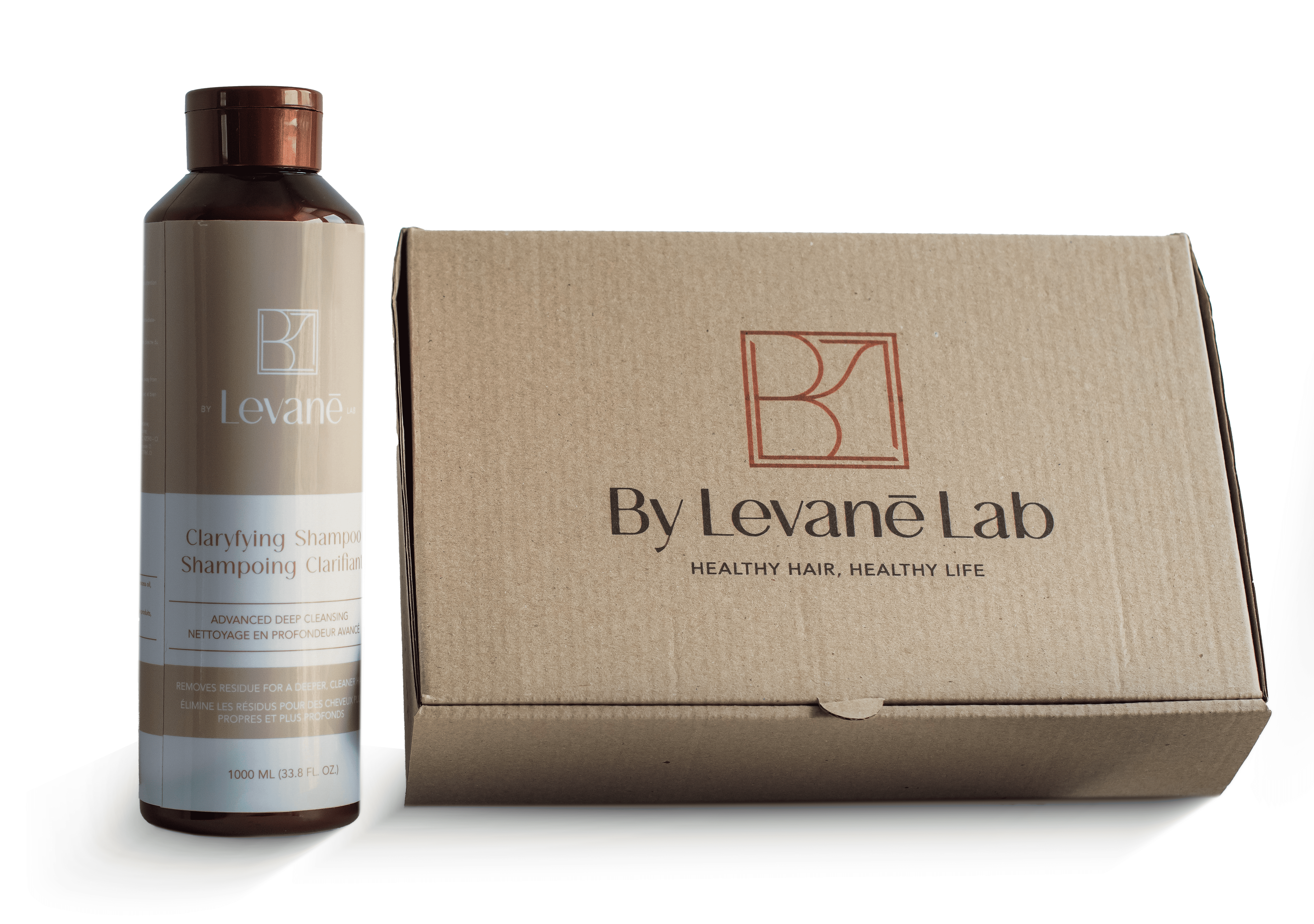 Shampoo bottle and box from By Levane Lab on a white background