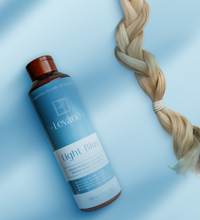 Levane hair product bottle with a blonde hair on a light blue background