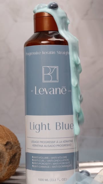 Light Blue keratin treatment bottle with blueberry cream and coconut